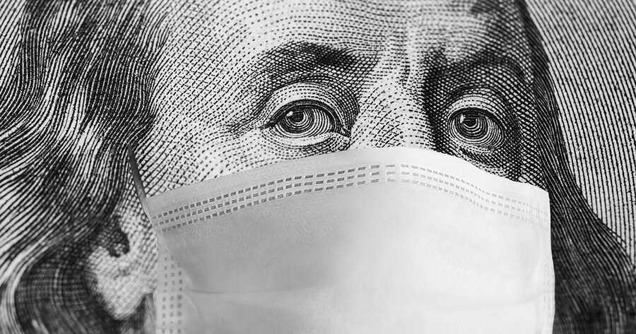Closeup of Ben Franklin’s face on the bank note with a protective mask around his mouth and nose