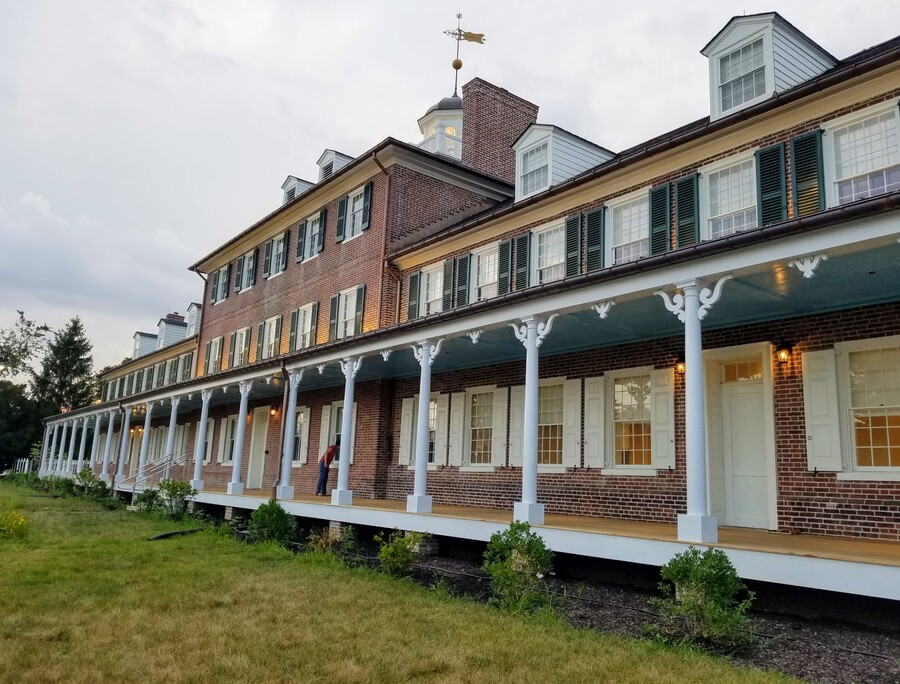 A long brick building with columns