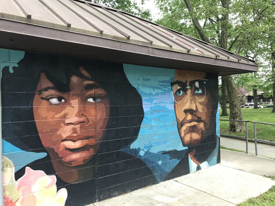 A mural at Malcolm X Park at 51st and Pine streets depicting Malcolm X and his wife Betty Shabazz.