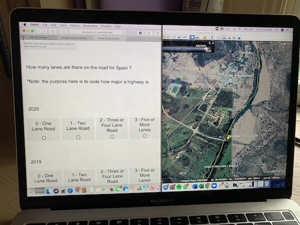 Laptop screen showing a satellite image of an area in Spain.