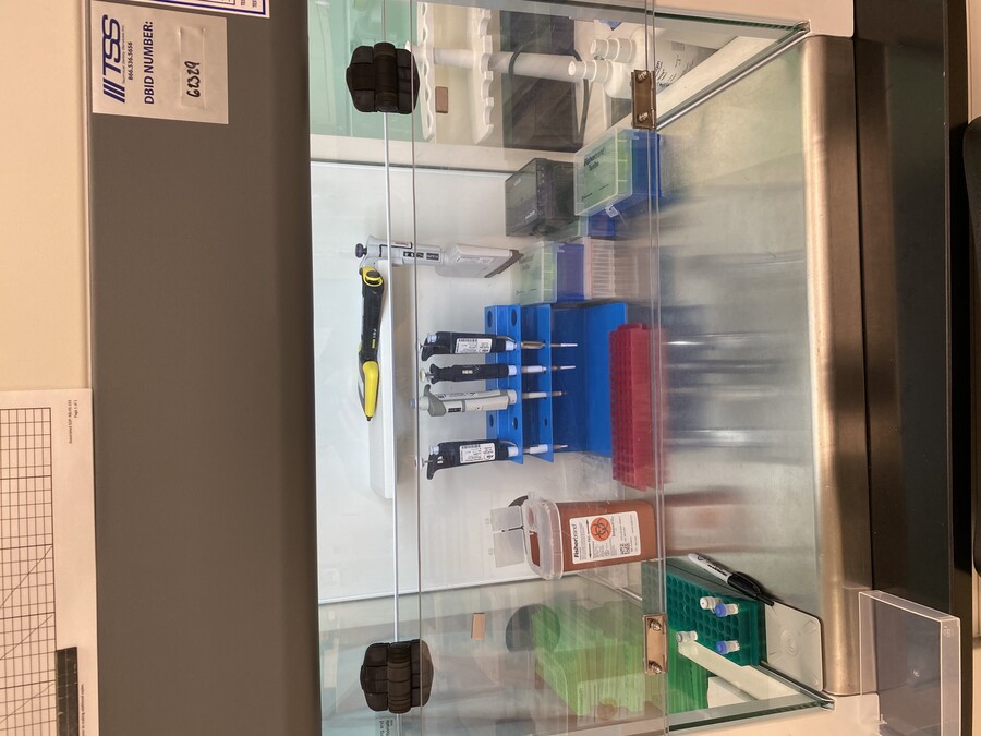 Laboratory equipment behind a protective window