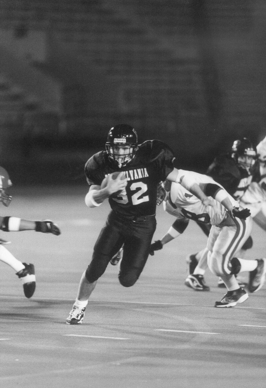 Tim Ortman runs with the football.