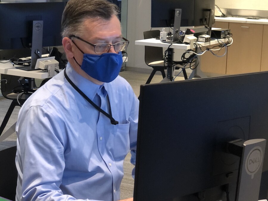 john lapinski working on a computer