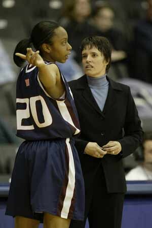 Jewel Clark converses with Coach Kelly Greenberg.