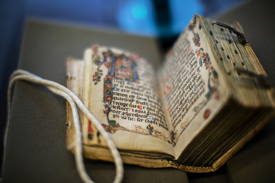 An old, rare book laid out in preparation for scanning at Penn Libraries.