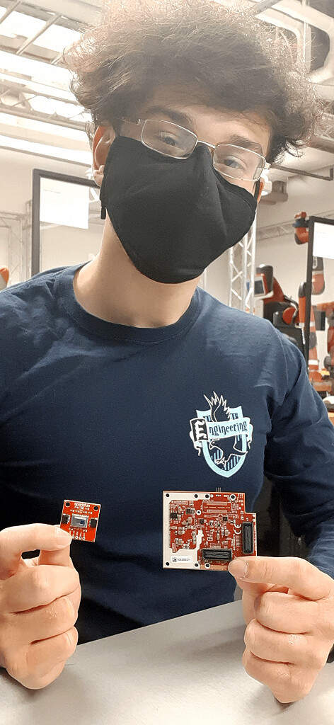 Brandon Gonzalez wears a face mask in the GRASP Lab.
