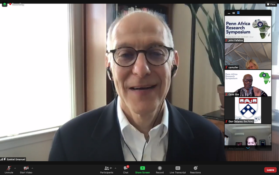 A Zoom video event shows man in a traditional African print shirt with the words "Penn AfA man in glasses, black blaze and white shirt participates in a zoom call, as five participants are seen in video images on the right side of the screen, stacked vertically.
