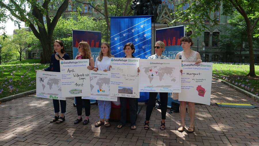 A group of people holding posters that read Data Refuge Stories stand in a line