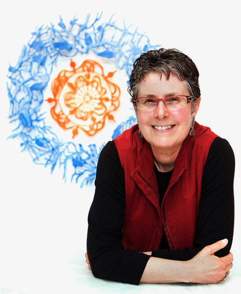 portrait of rebecca kamen in front of an abstract painting