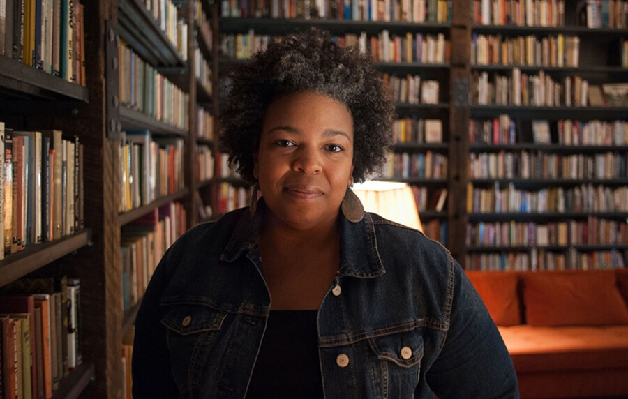 Samantha Hill standing in a library.
