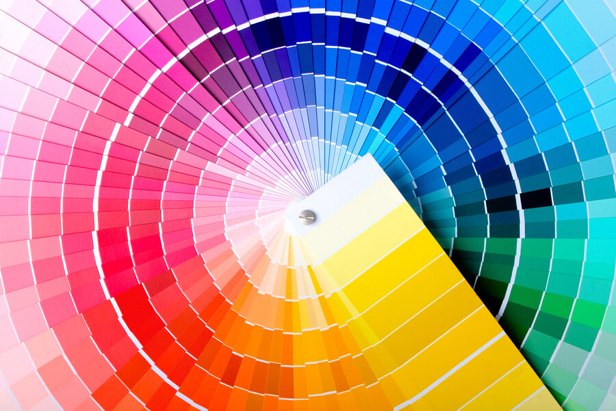 fanned out color sample sheets depicting a rainbow of shades