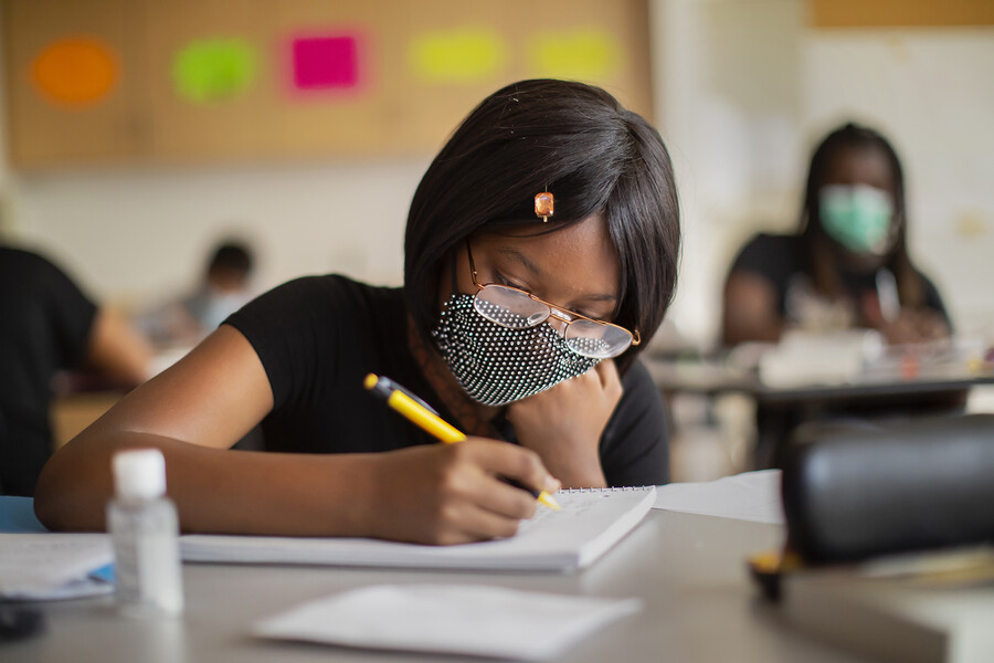 close up of student working in classroom