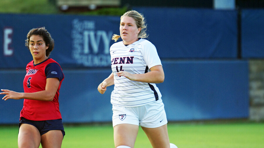Shenk runs up the field during a game at Rhodes Field.