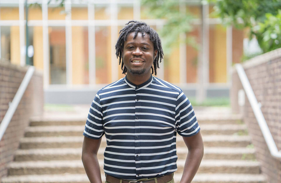 Darin Johnson stands outside in front of steps.