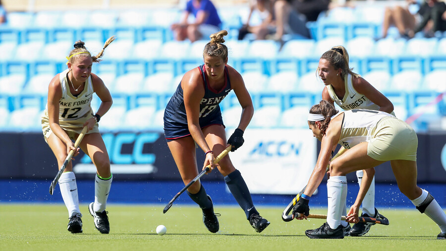 Banks maneuvers between three defenders during a game, with control of the ball.