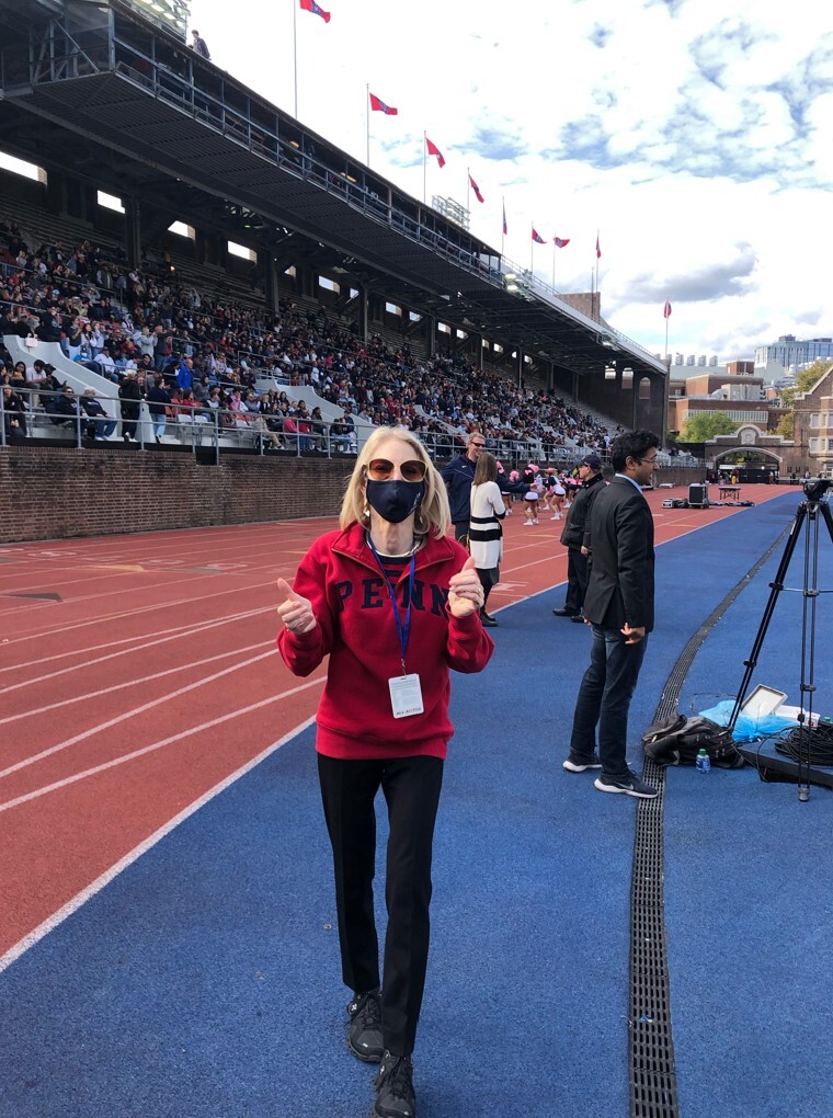 President Amy Gutmann cheers on the Quakers on Saturday at Franklin Field.