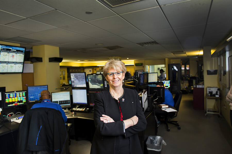 Maureen Rush poses for photo in PennComm center
