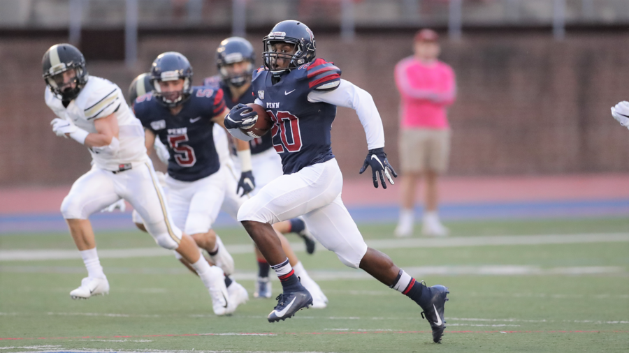 Laquan McKever runs with the ball at Franklin Field.