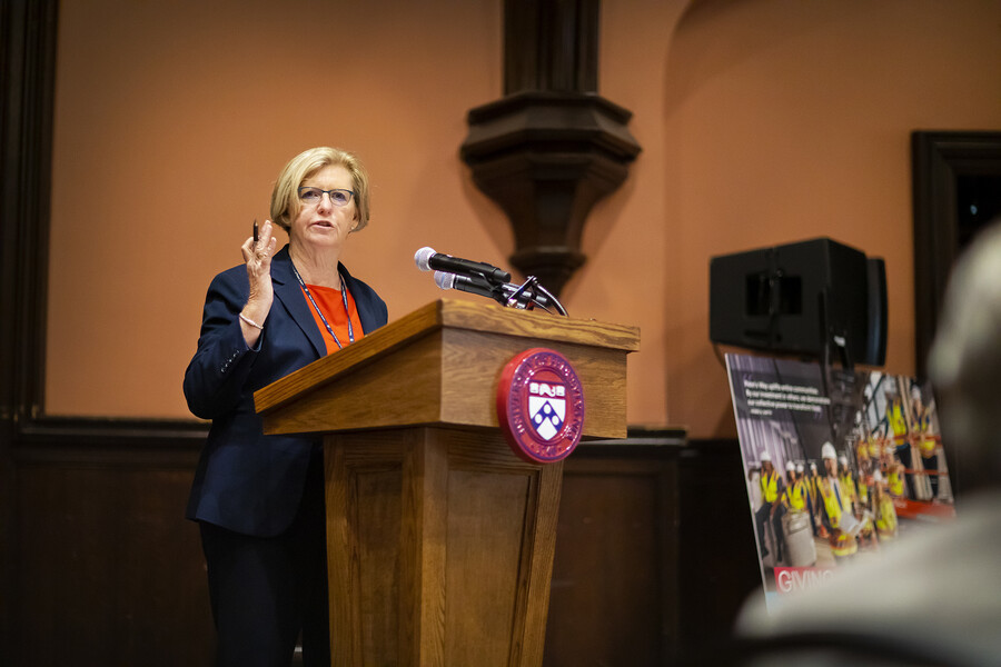 Maureen Rush talking at podium