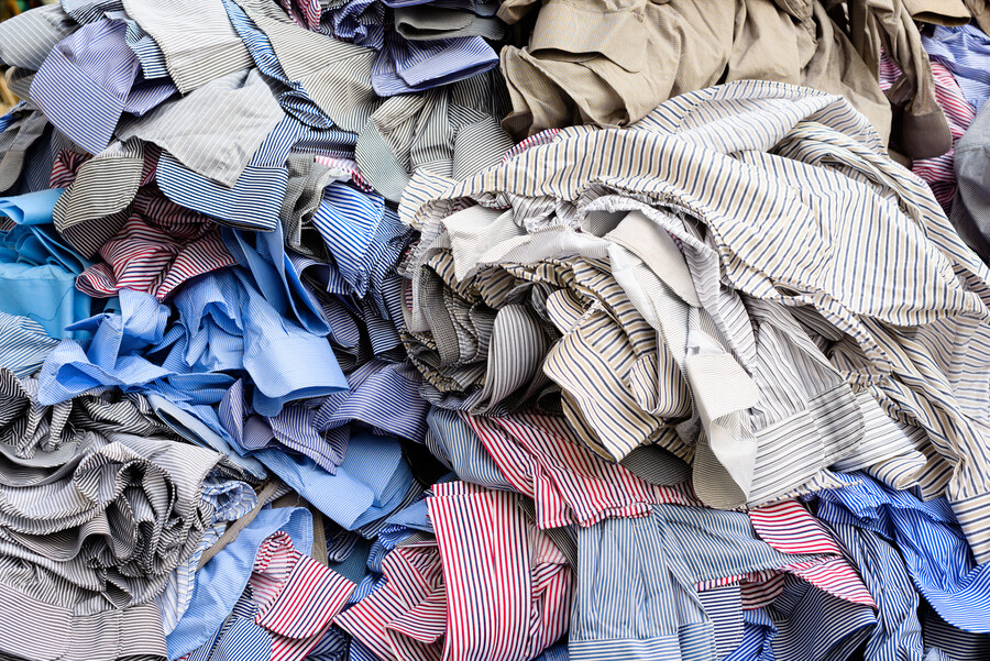 A large pile of discarded shirts.
