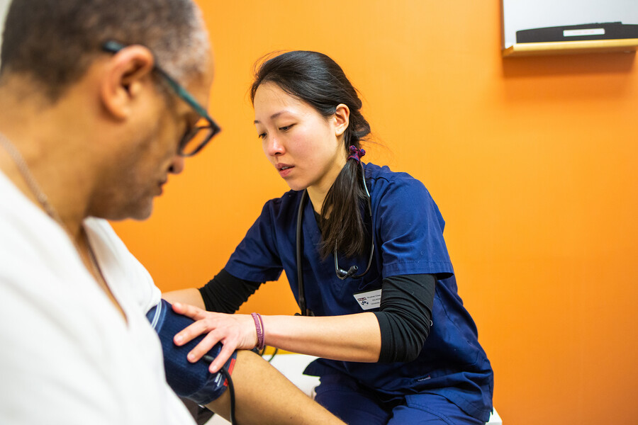 nursing student taking blood pressure