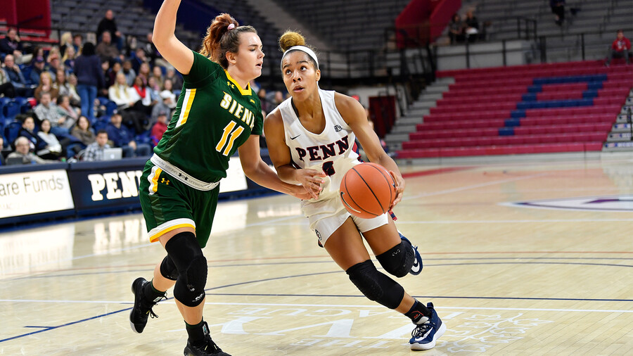Suttle drives to the basket against Siena.