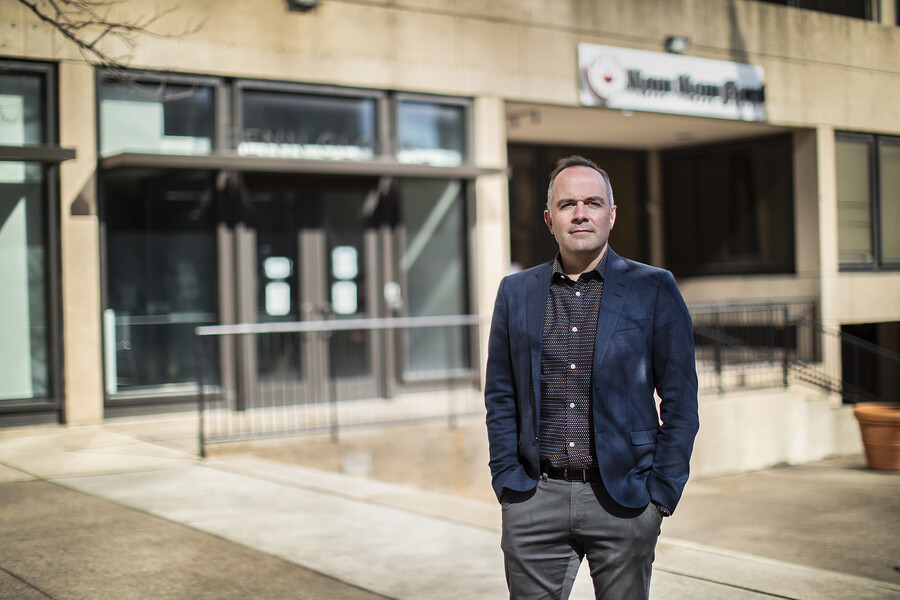 Nigel Cossar stands in front a a building on Penn’s campus.