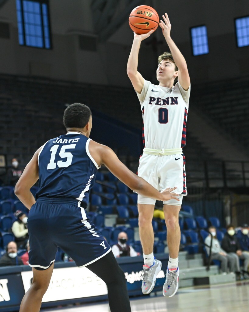 Clark Slajchert jumps in the air to shoot against Yale.
