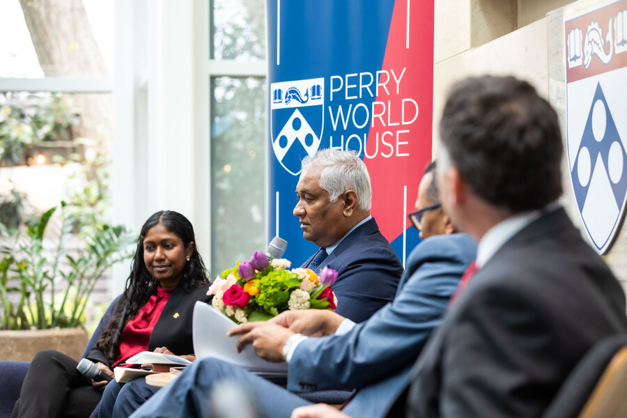 Satyendra Prasad of Fiji holds microphone while speaking about climate change's effects on Fiji