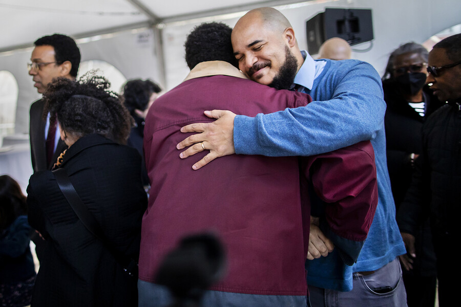 chaplain howard hugs an attendee at the du bois college house celebration