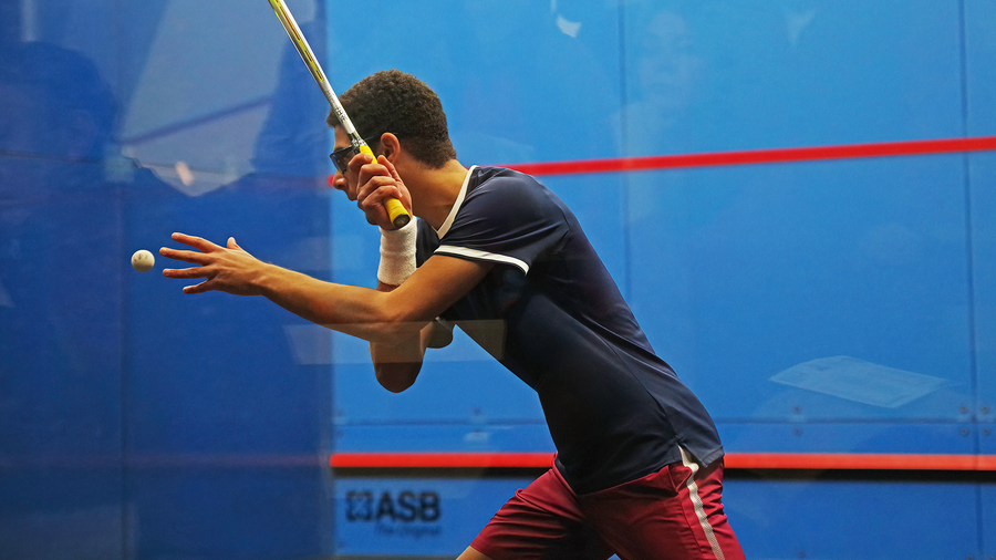 Aly Abou Eleinen prepares to hit the ball at the Penn Squash Center.