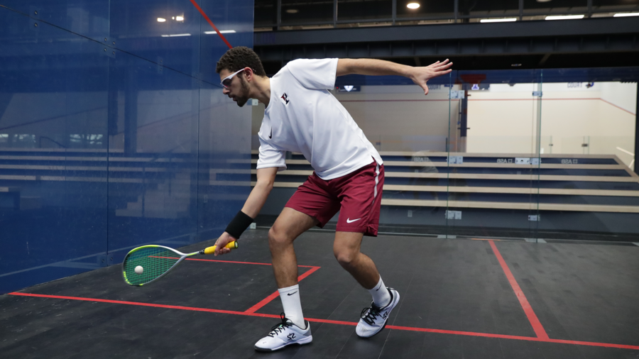 Aly Abou Eleinen hits the ball down by his feet.