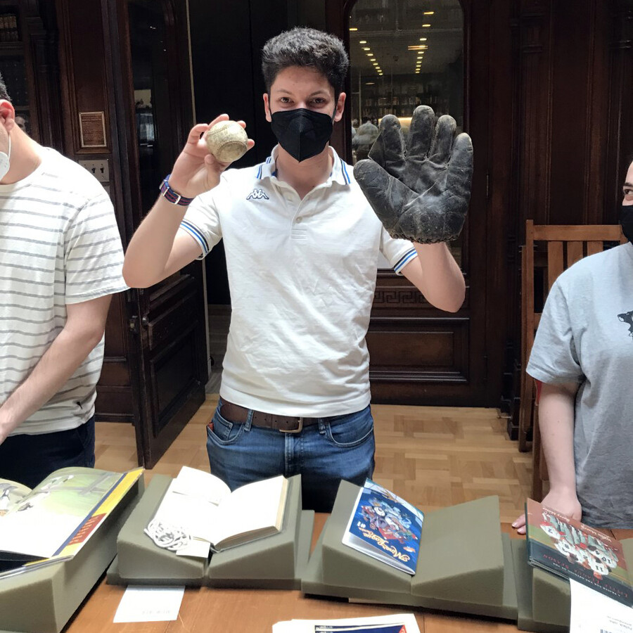 students hands on with baseball history