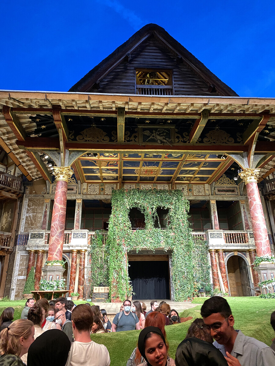 Wharton International students in front of the stage at the Globe Theater.