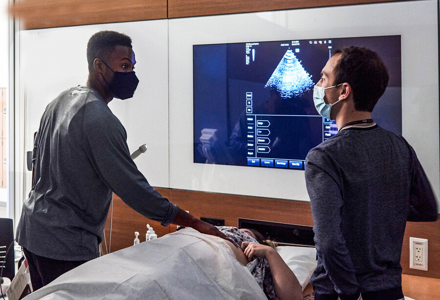 med students working with a standardized patient