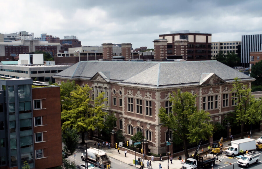 Aerial street view of a Penn law building on a city corner.