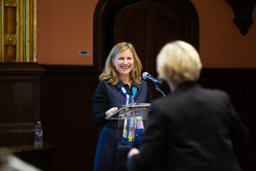 President Magill talking at the podium.