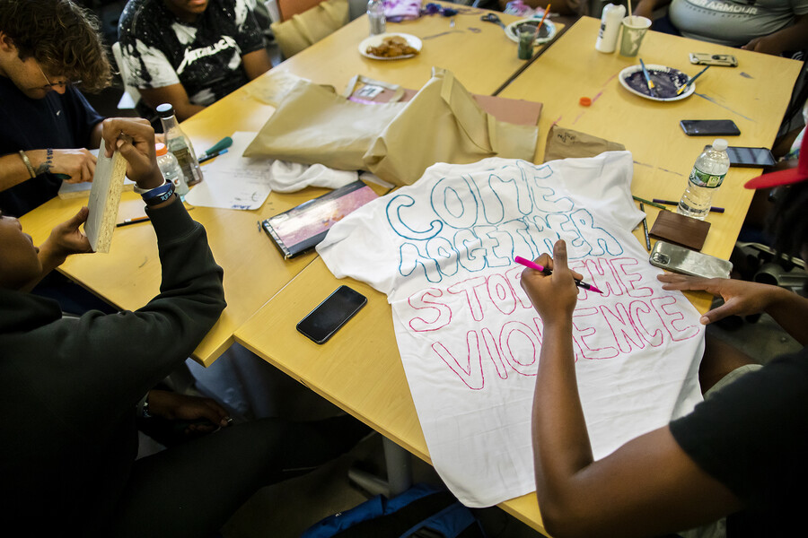 close up of tshirts being designed by high school students