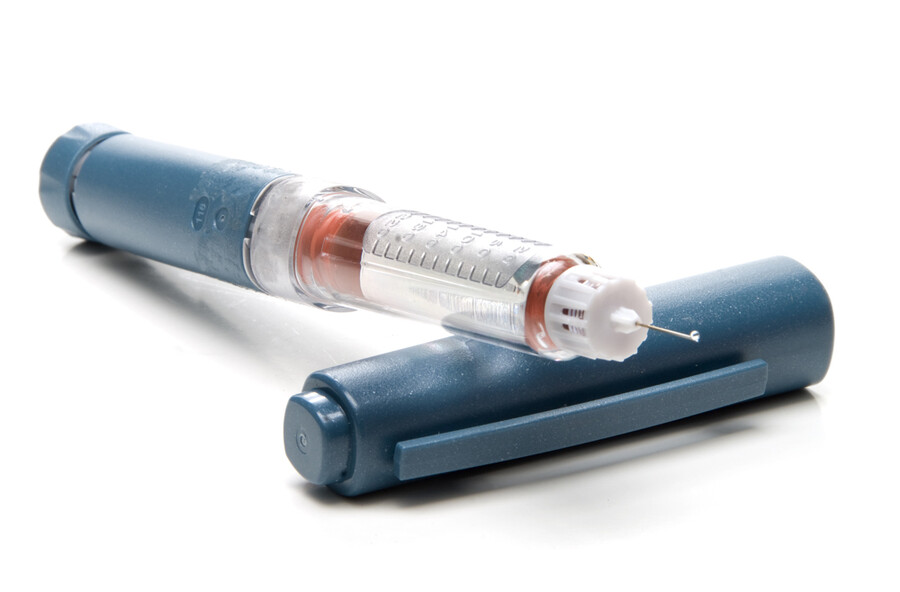An uncapped insulin pen.