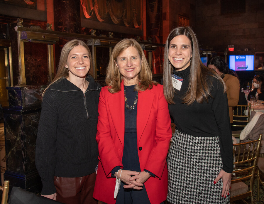 Magill smiles for a photo with Penn alumni