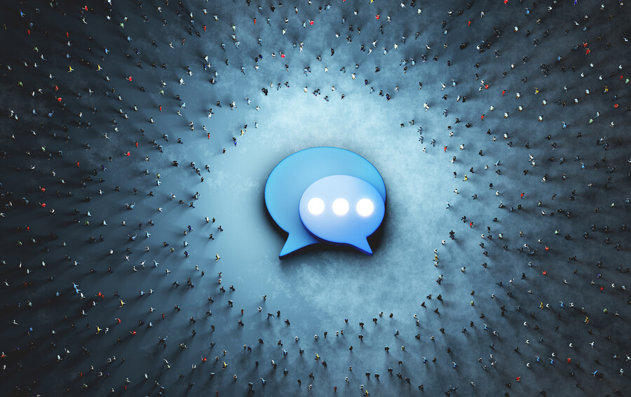 A Twitter icon on the ground with a large crowd of people circling, as seen from above.