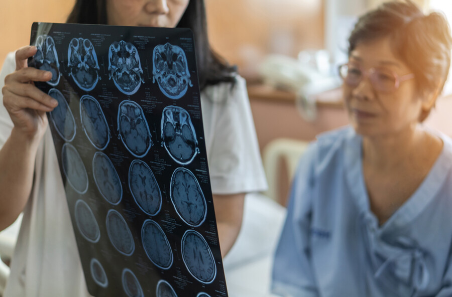 Doctor and patient looking at results of a brain scan.