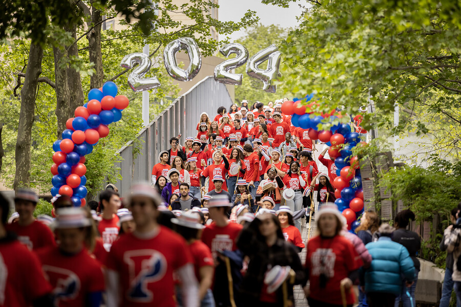 students walk over the 38th street bridge during hey day