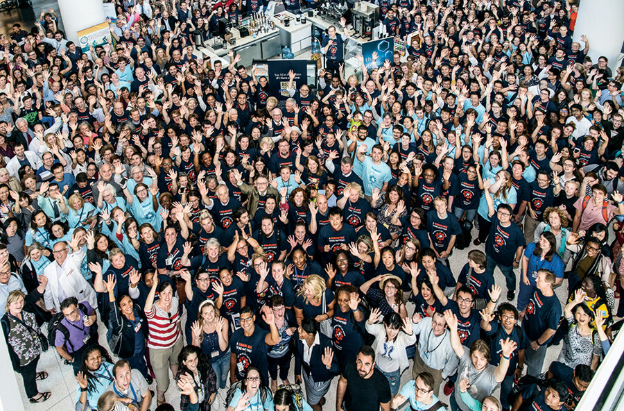 Aerial image of Penn Medicine staff in the atrium celebrating.