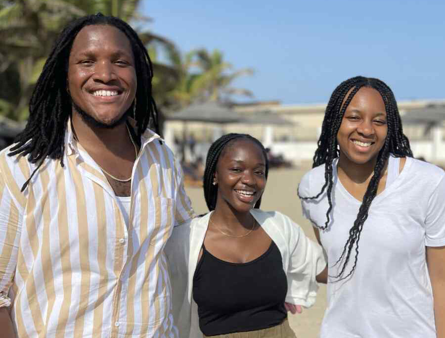 Frank Deese (left) and Chisom Nwakama (right) with Bessy Crensil..
