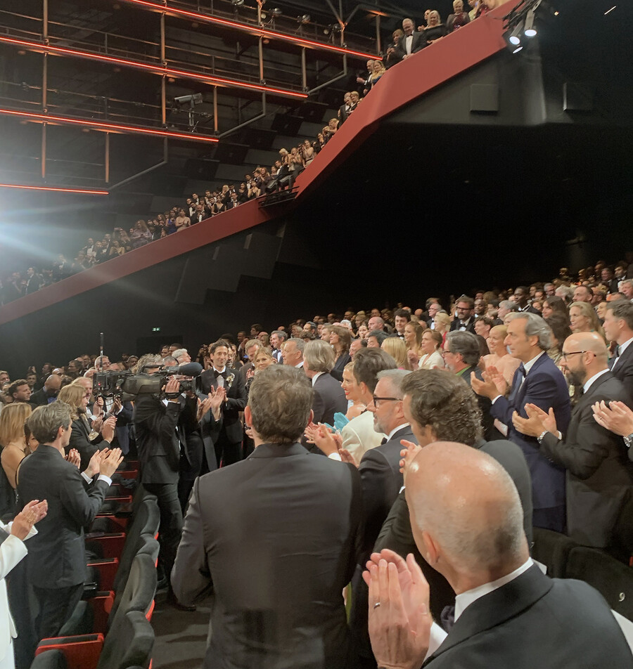 theater filled with people on two levels