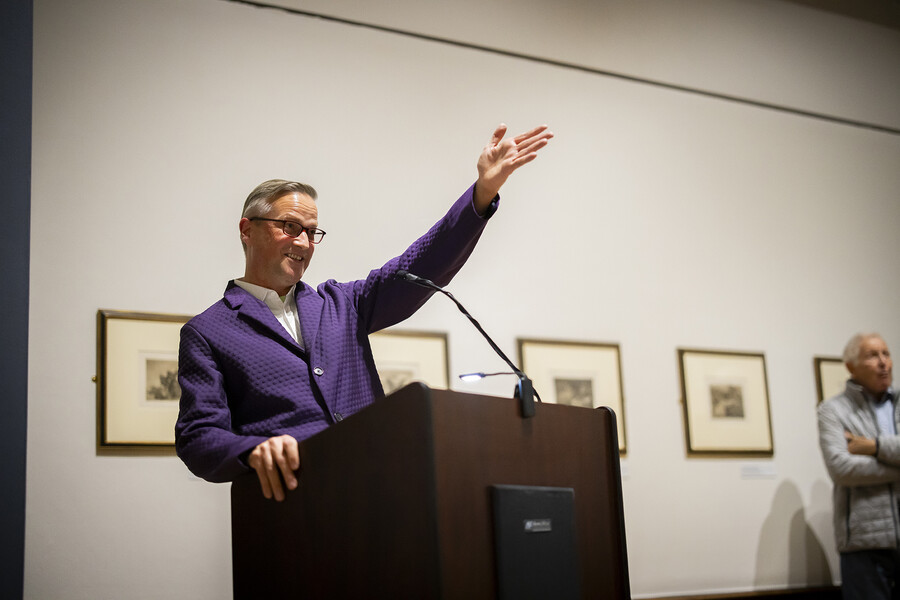Andre Dombrowski at the podium gesturing upwards