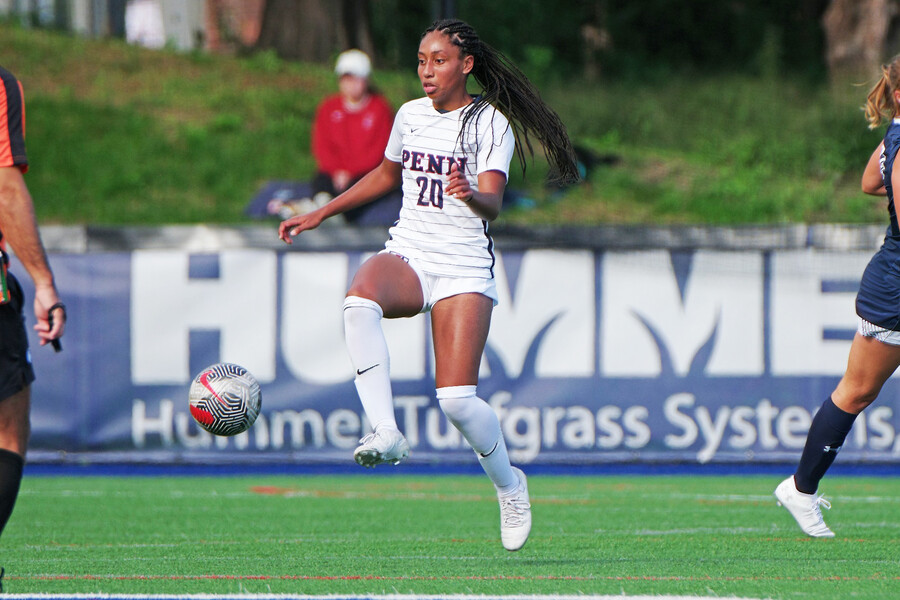 Ginger Fontenot kicks the ball midair during a home game.