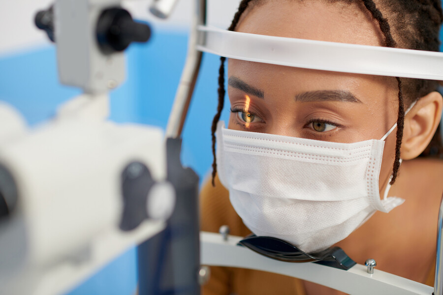 A person at an optometrist having their eyes checked.