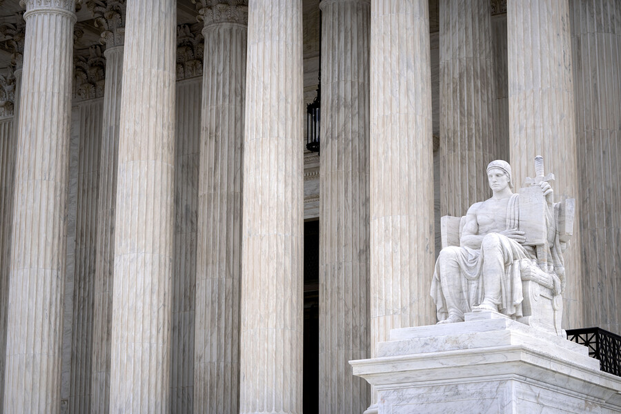 he Guardian of Law sculpture is seen at the west entrance of the Supreme Court in Washington.